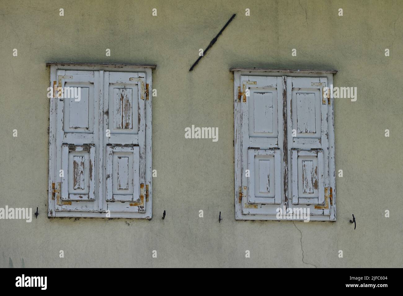 Aquileia, Italy. 19 June 2022. House wall in Aquileia with wooden window beams Stock Photo