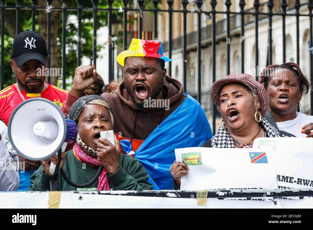 Whitehall, London, UK. 01st July, 2022. Protesters opposite Downing Street, including many from the Congolese Community in Great Britain, rally against UK deportations of refugees and migrants to Rwanda, which they perceive to be racist and supporting a criminal regime. Credit: Imageplotter/Alamy Live News Stock Photo