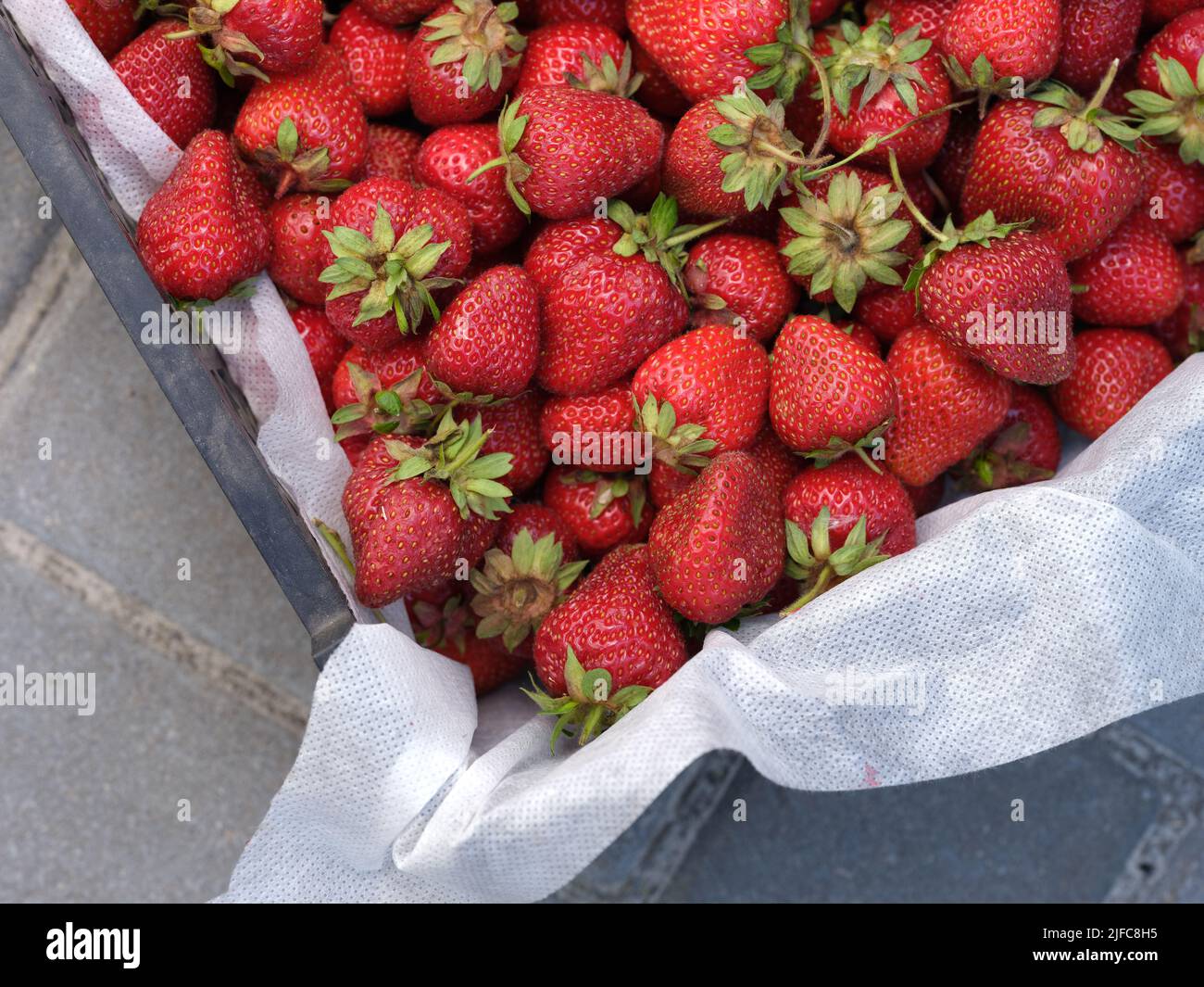 Fresh organic strawberries in a crate. Close up. Stock Photo
