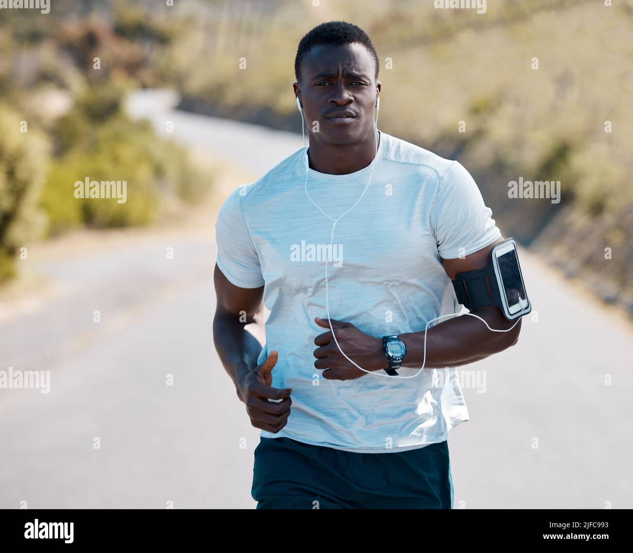 One handsome young african american athlete listening to music while