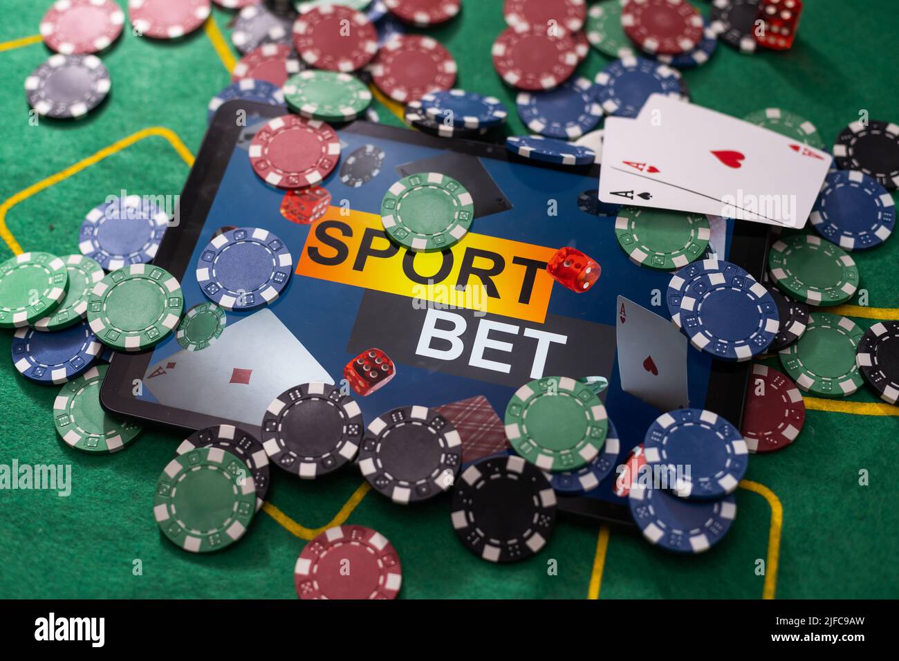 Smartphone with poket table on screen, playing cards and chip cards on ...