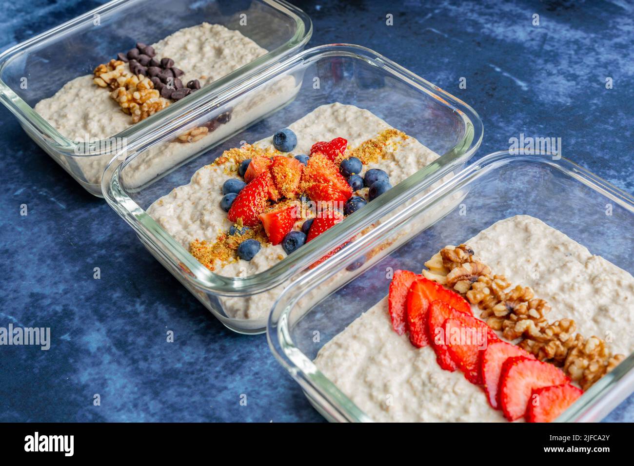Three oatmeal breakfast combinations with different toppings Stock