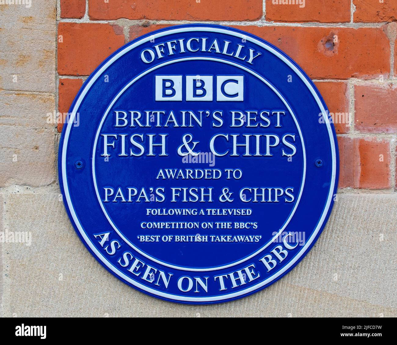 Whitby, UK - June 10th 2022: An award plaque on the exterior of a fish and chip shop in Whitby, North Yorkshire - the shop was voted as the Best Fish Stock Photo