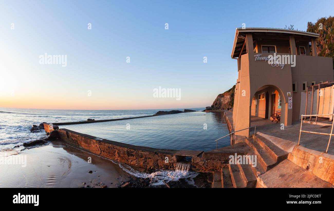 Beach tidal swimming pool at Thompsons Bay North Coast South Africa early morning sunrise over the ocean horizon. Stock Photo