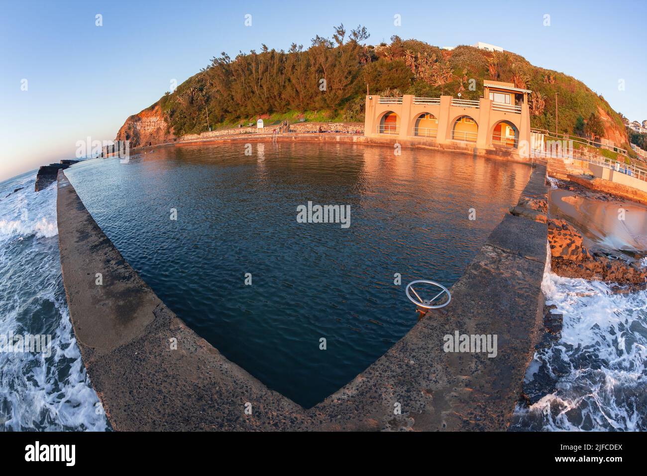 Beach tidal swimming pool at Thompsons Bay North Coast South Africa early morning sunrise over the ocean horizon. Stock Photo