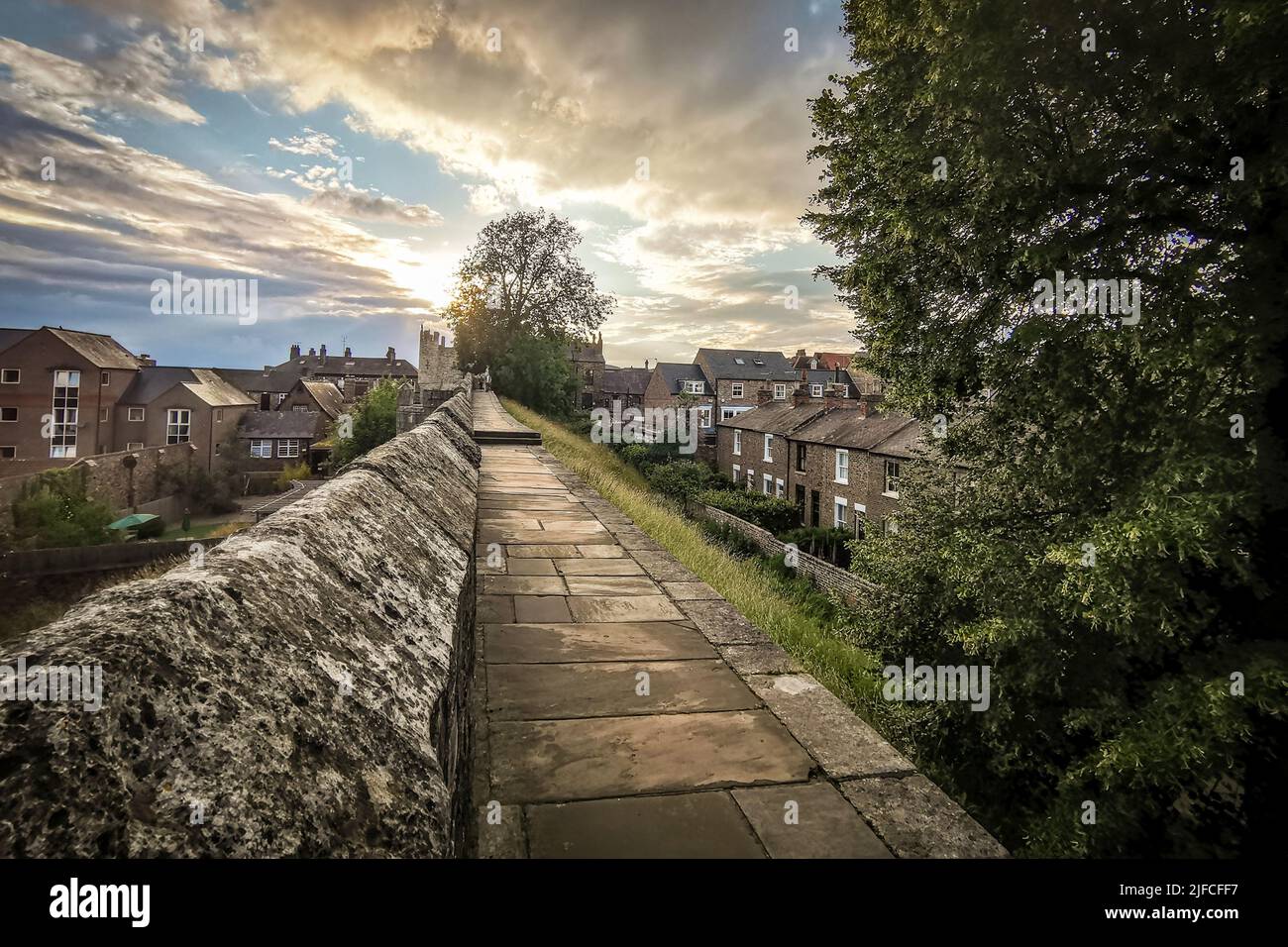York, UK. 01st July, 2022. The sun sets over the city walls in York. Credit: Thomas Faull/Alamy Live News Stock Photo