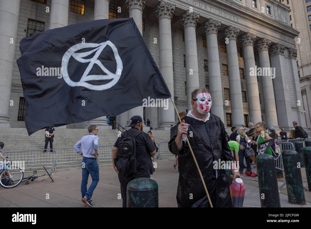 NEW YORK, N.Y. – June 30, 2022: Extinction Rebellion protesters rally after the U.S. Supreme Court curbed the EPA's authority to regulate emissions. Stock Photo