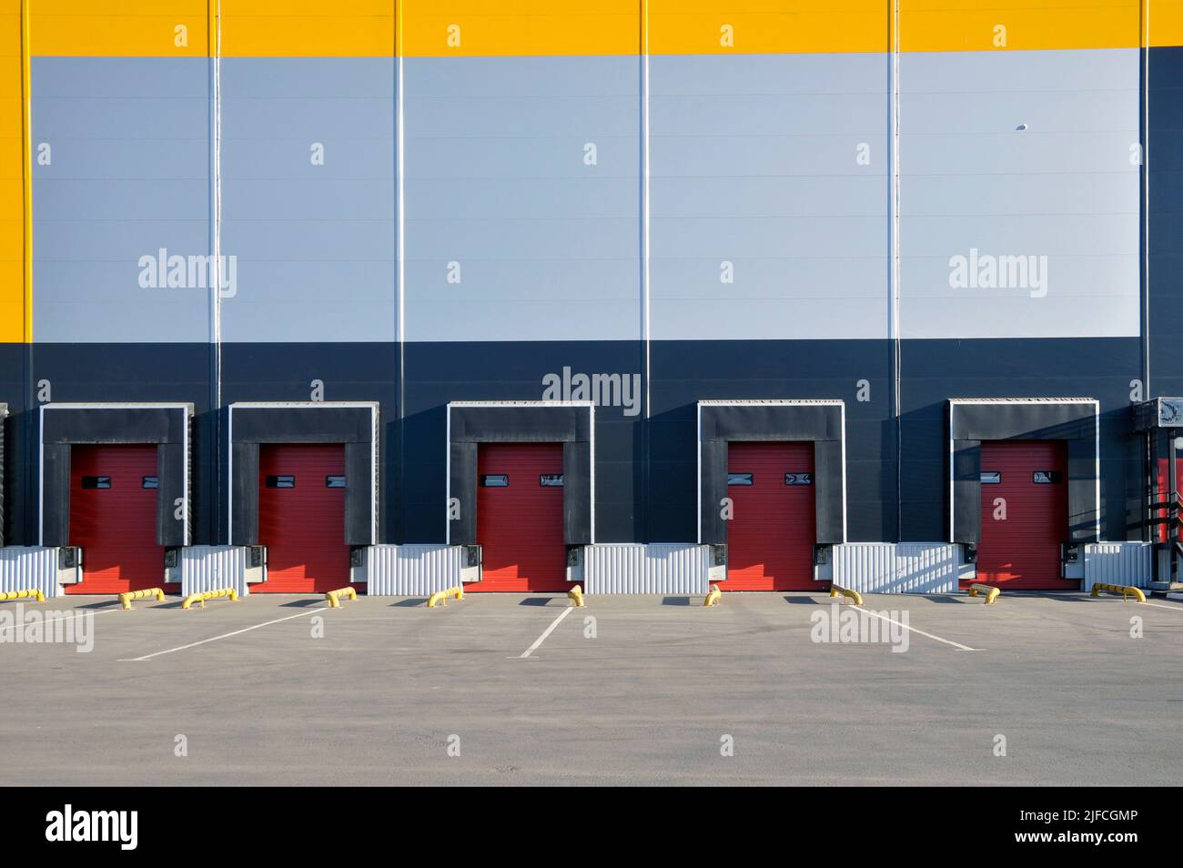 Modern warehouse complex. Warehouse building with many loading gates. Stock Photo