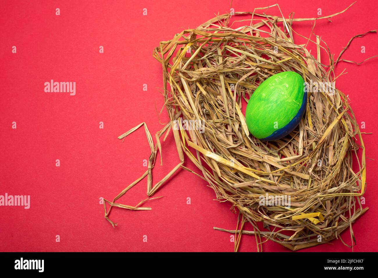 Fancy White Easter Eggs With Funny Green Bunny Ears In Straw Nest On Brown  Paper Background Traditional Spring Concept Stock Photo - Download Image  Now - iStock