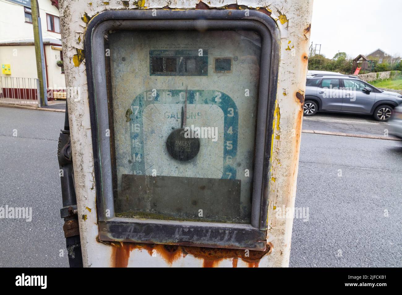 LLANRUG, WALES – MAY 10  2021: Detail of derelict vintage Avery-Hardoll petrol fuel gas pump portrait selling in gallons. Stock Photo