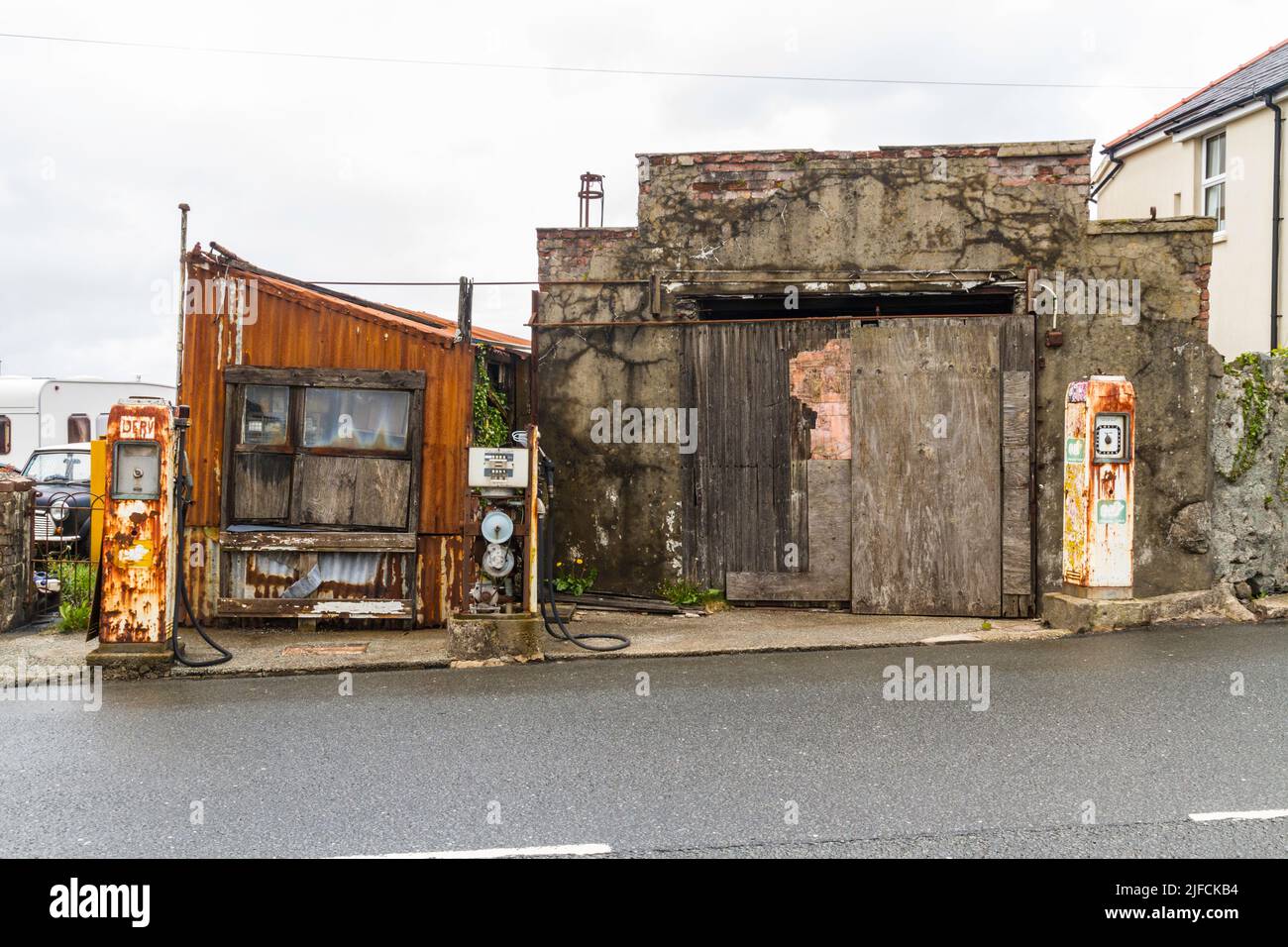 LLANRUG, WALES – MAY 10  2021: Detail of derelict vintage filling petrol station Stock Photo