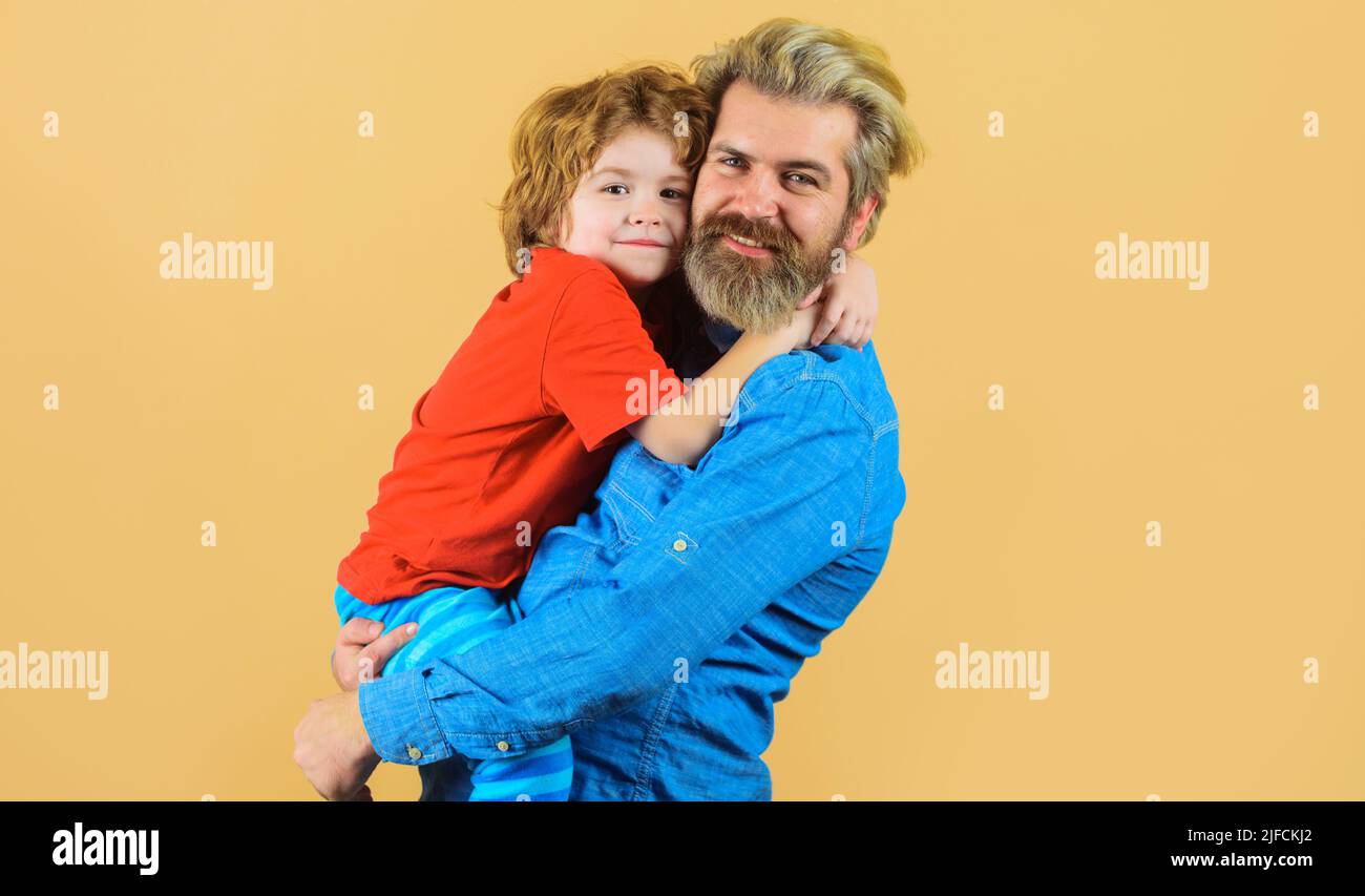 Father hugs with son. Family or Fathers day. Dad and child boy embrace. Parenthood, childhood. Stock Photo