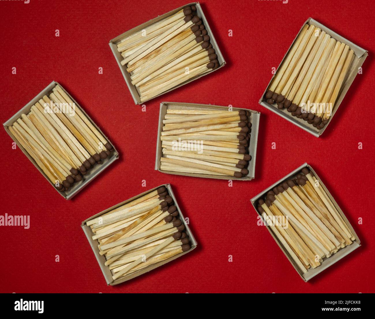 Matches on a red background. Safe handling of fire. Fire dangers. Lots