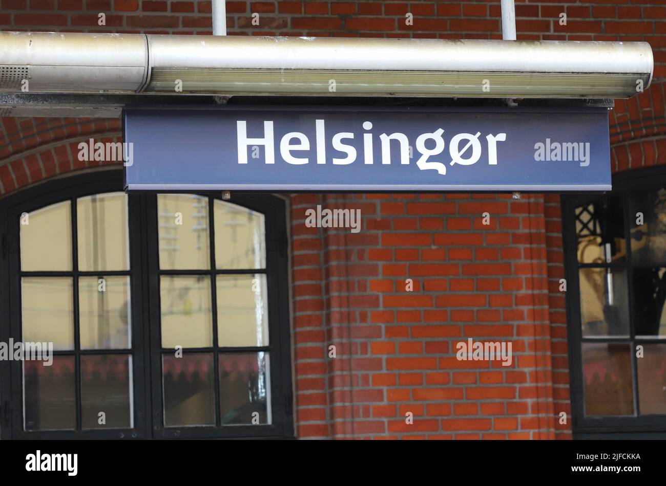 Close-up view of the Danish railroad station Helsingor name sign. Stock Photo