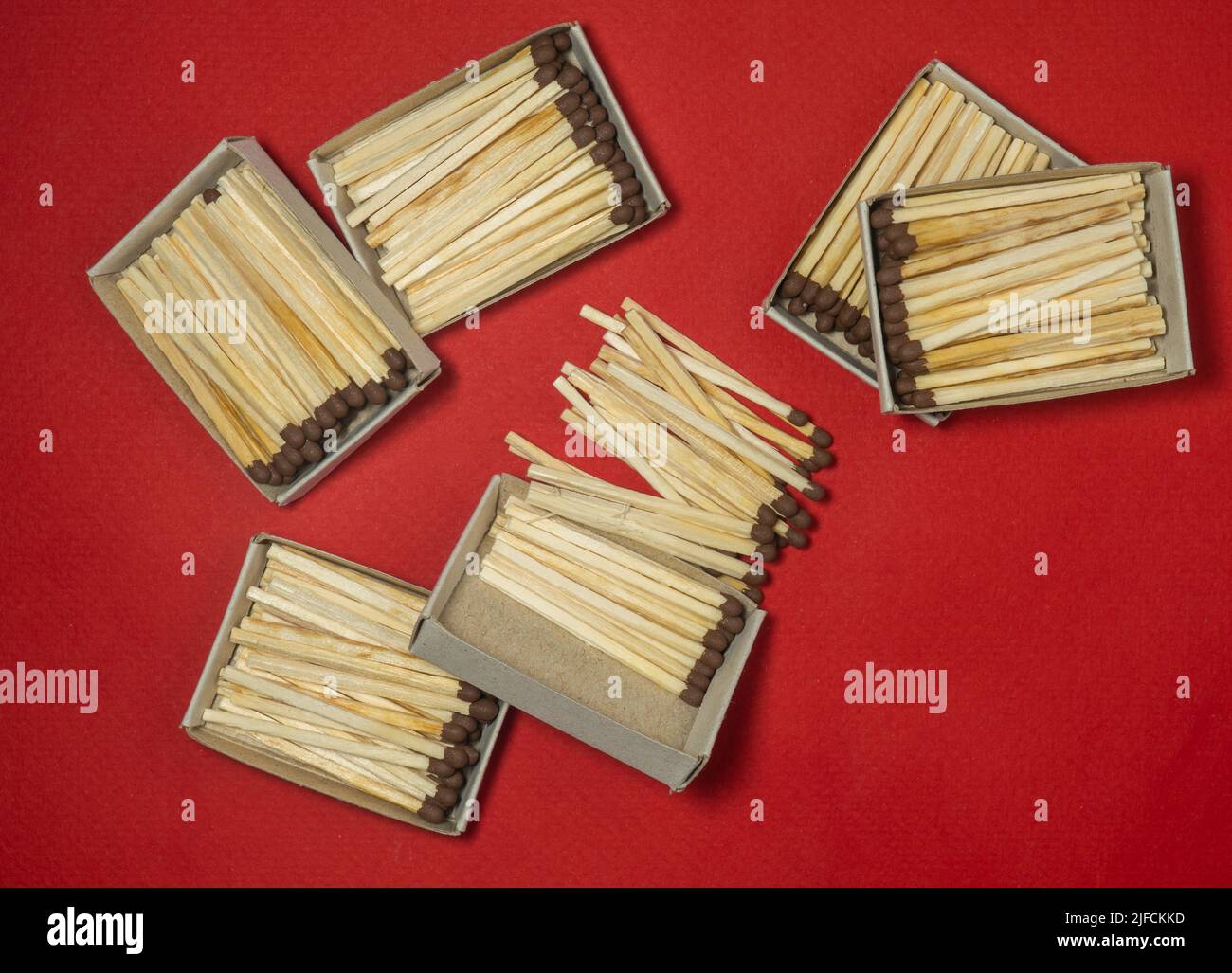 Matchsticks on a red background. Safe handling of fire. Fire dangers ...