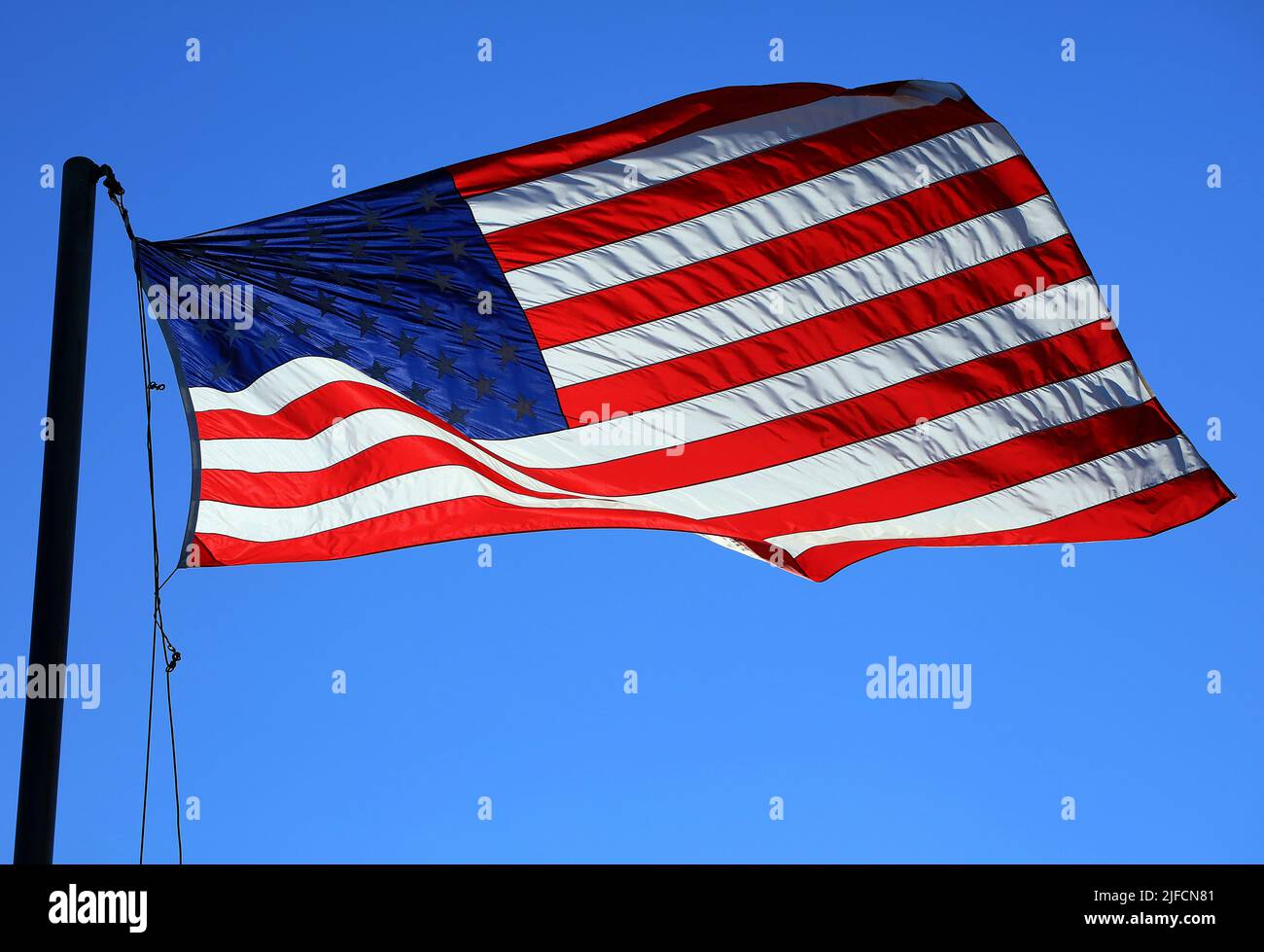 American Flag flying on a flagpole - Washington DC, USA Stock Photo