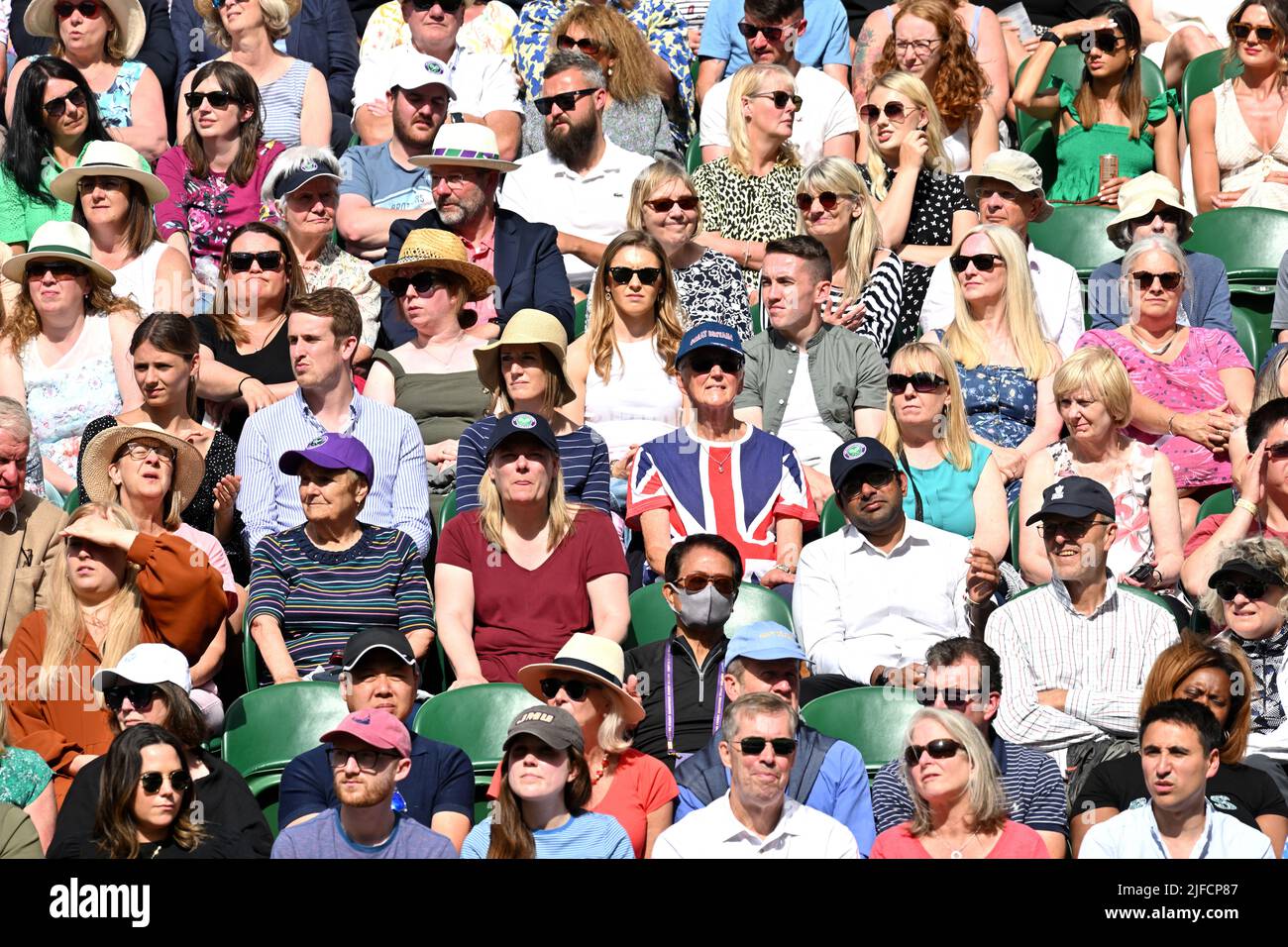 01 July 2022. London, United Kingdom.  Seated spectators watch centre court tennis from the Royal Box on day 5 of the Wimbledon Tennis Championships held at the All England Lawn Tennis and Croquet Club. Photo by Ray Tang. Stock Photo