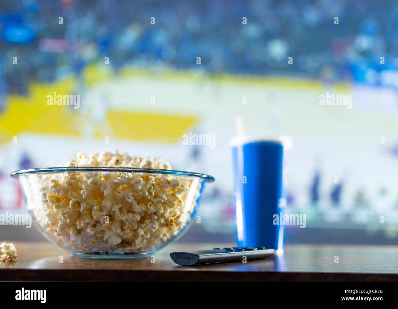 Sports Popcorn On a sporty backdrop, a classic set of a sports fan - a carbonated ...