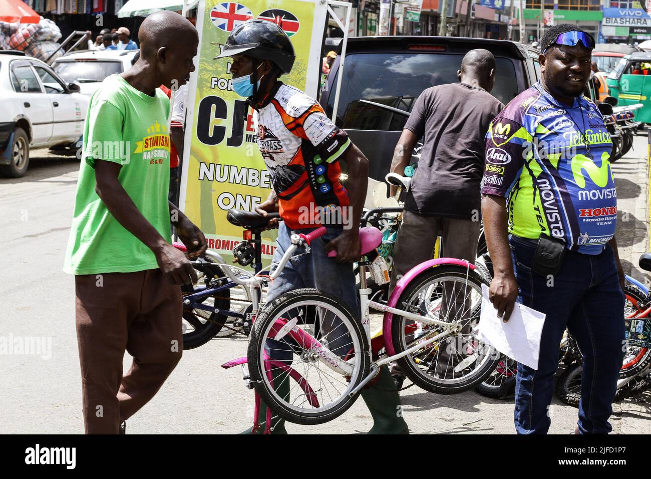 A man seen carrying second-hand bicycle parts imported from the UK to an  assembling warehouse in Nakuru Town. Bicycles are becoming a popular mode  of transport in both urban and rural areas. (