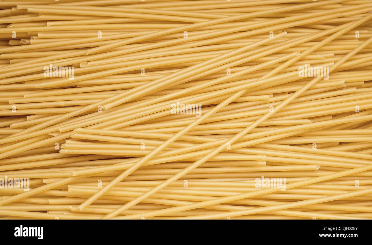 Tubes spaghetti pasta in in quantities macaroni texture Stock Photo