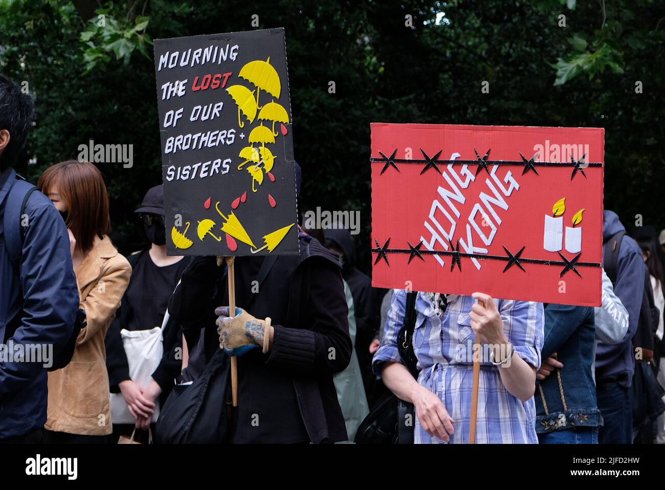 London, UK, 1st July, 2022. Hong Kong pro-democracy activists held a rally outside the Hong Kong Trade & Economic Office on the 25th anniversary of the British handover back to China, when it was agreed that territory would retain civil liberties under the principle of 'one country, two systems', for 50 years after 1997.   Growing concern over the crackdown on protest, closure of several news outlets, and the introduction of the national security law have led to some Western nations' criticism of interference by Beijing authorities. Credit: Eleventh Hour Photography/Alamy Live News Stock Photo