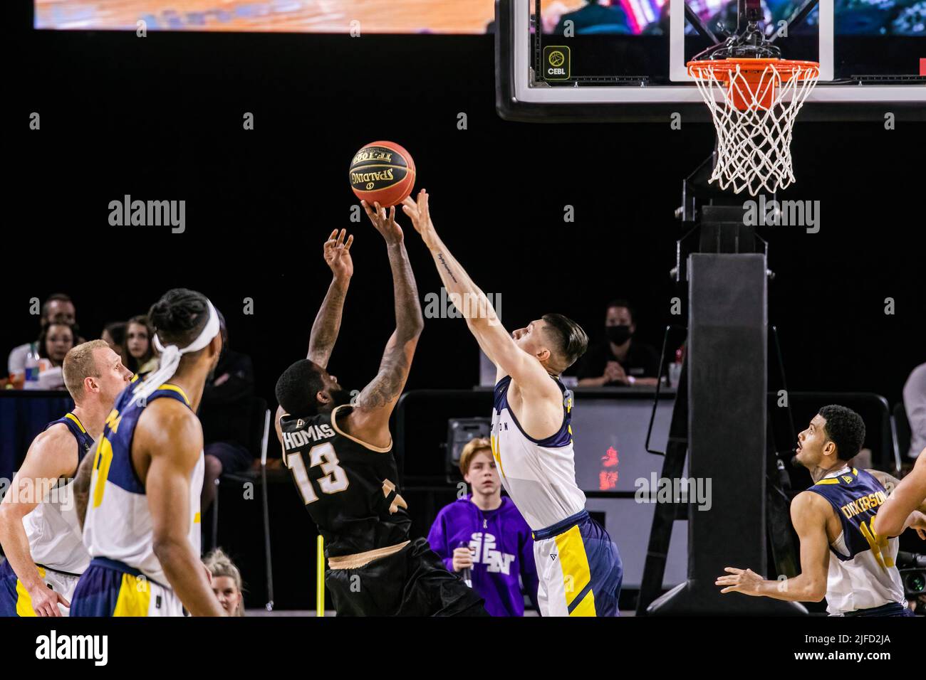 Edmonton's #14 Brody Clarke (forward) gets up over Newfoundland's #13 Terry Thomas (Guard) during the Edmonton Stingers rout of the Newfoundland Growlers in Canadian Elite Basketball Action with a historic victory. Edmonton Stingers 120-69  Fraser Valley Bandits. Stock Photo