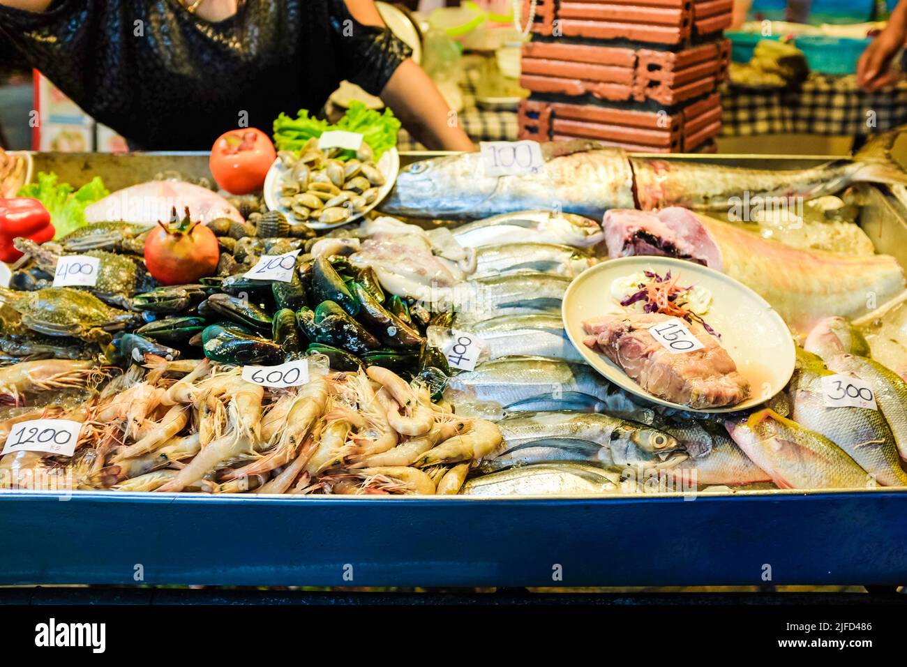 Seafood on ice sell in local fishery night market, outdoor restaurant