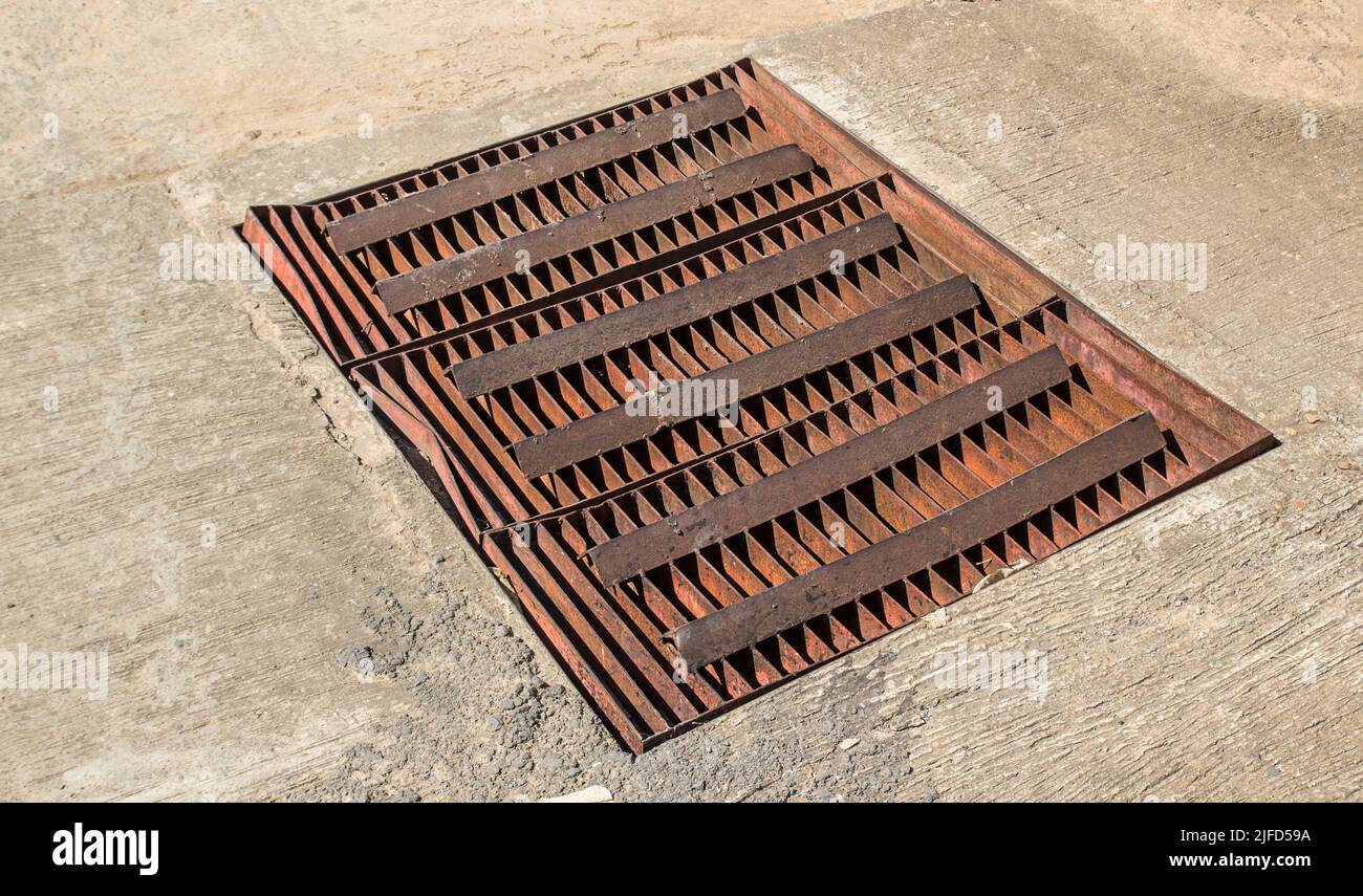 Close up sewer grate on the road Stock Photo