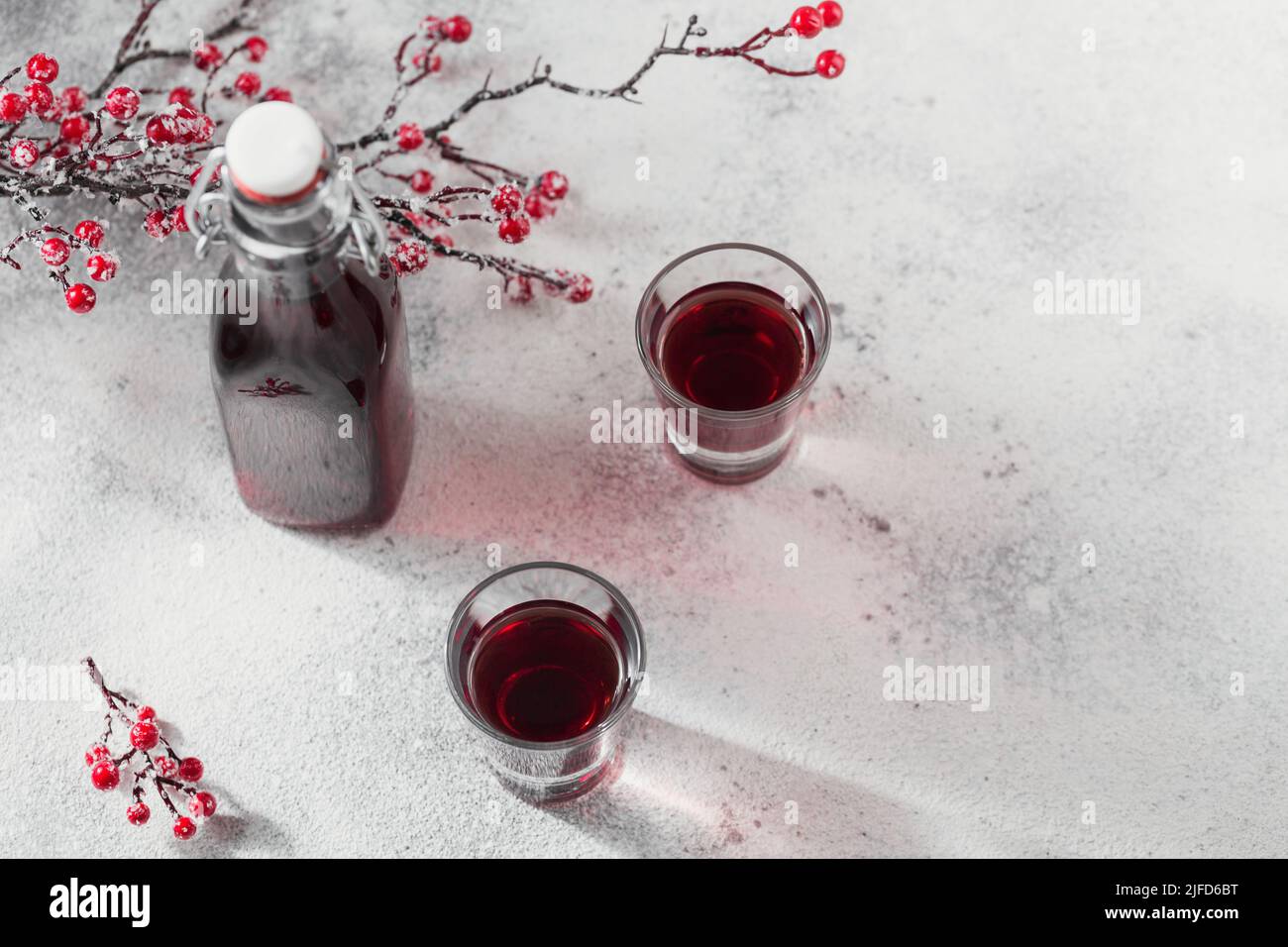 Homemade infused vodka, tincture or liqueur of red cherry Stock Photo