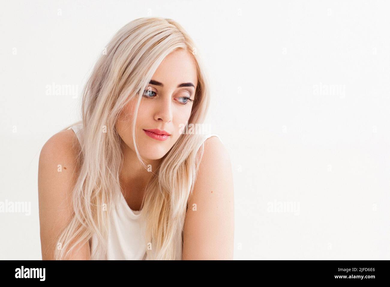 Portrait of young woman with contempt emotions Stock Photo