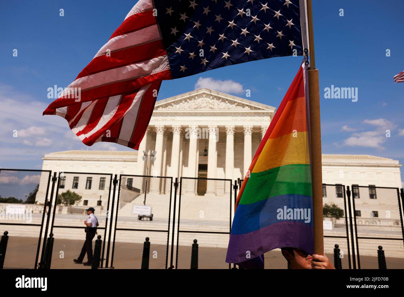 Washington, United States. 26th June, 2022. An American flag flies upside down next to a Pride flag outside the Supreme Court during a two day protest. More than 100 demonstrators gathered outside the Supreme Court of United States for an abortion rights rally. The rally comes one week after the Supreme Court of the United States issued its opinion in Dobbs v. Jackson Women's Health Organization which overturned Roe v. Wade and the right to abortion access. Credit: SOPA Images Limited/Alamy Live News Stock Photo