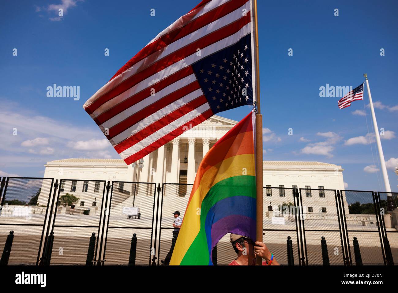 Washington, United States. 26th June, 2022. An American flag flies upside down next to a Pride flag outside the Supreme Court during a two day protest. More than 100 demonstrators gathered outside the Supreme Court of United States for an abortion rights rally. The rally comes one week after the Supreme Court of the United States issued its opinion in Dobbs v. Jackson Women's Health Organization which overturned Roe v. Wade and the right to abortion access. Credit: SOPA Images Limited/Alamy Live News Stock Photo