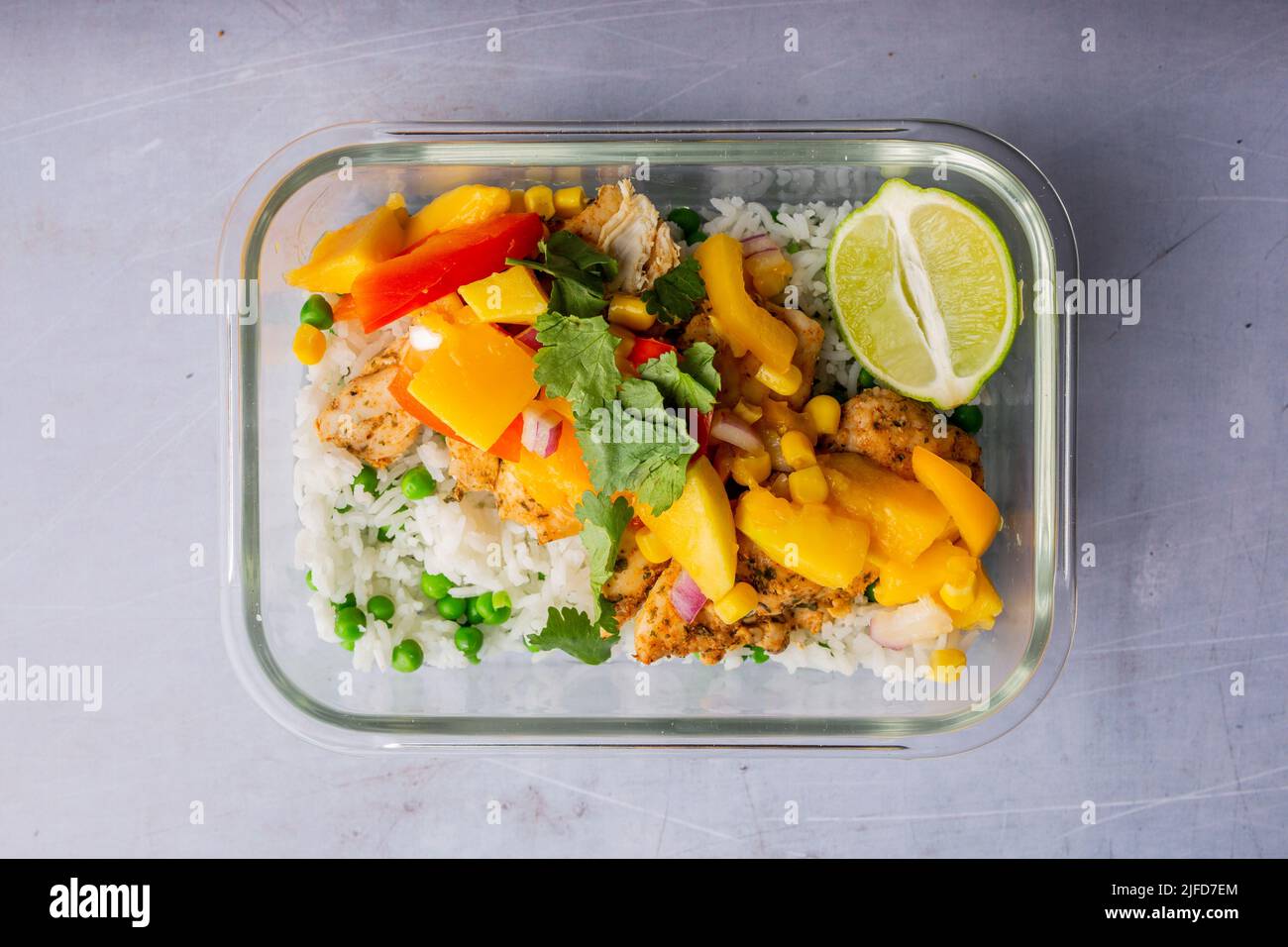 A top view of a chicken prepared with rice and vegetables in a ...