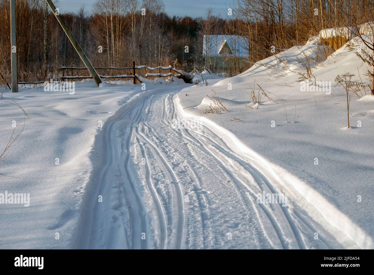 Village road snowmobile tracks hi-res stock photography and images - Alamy