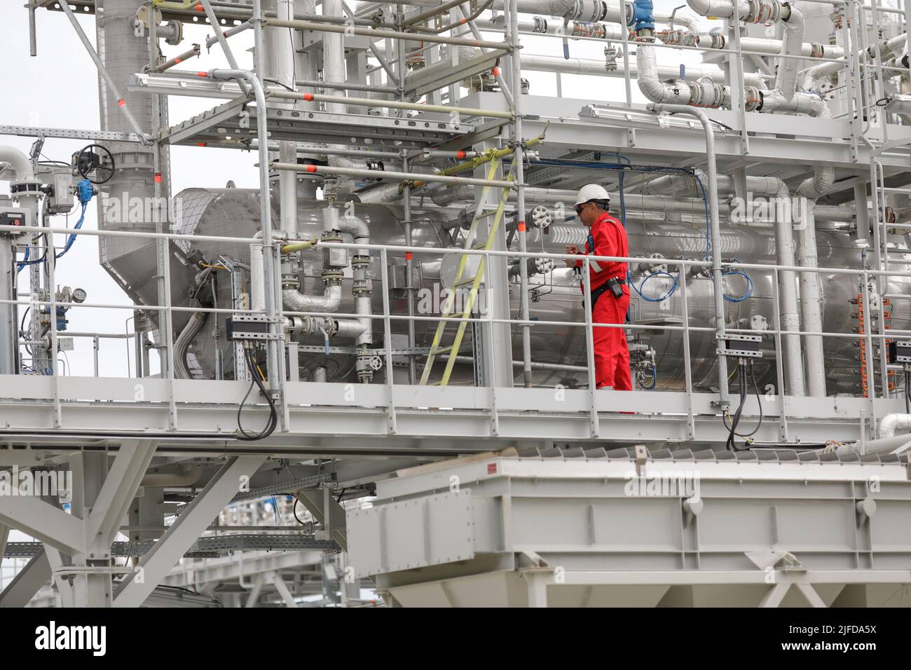 Vadu, Romania - June 28, 2022: Engineer works at a gas treatment plant. Stock Photo