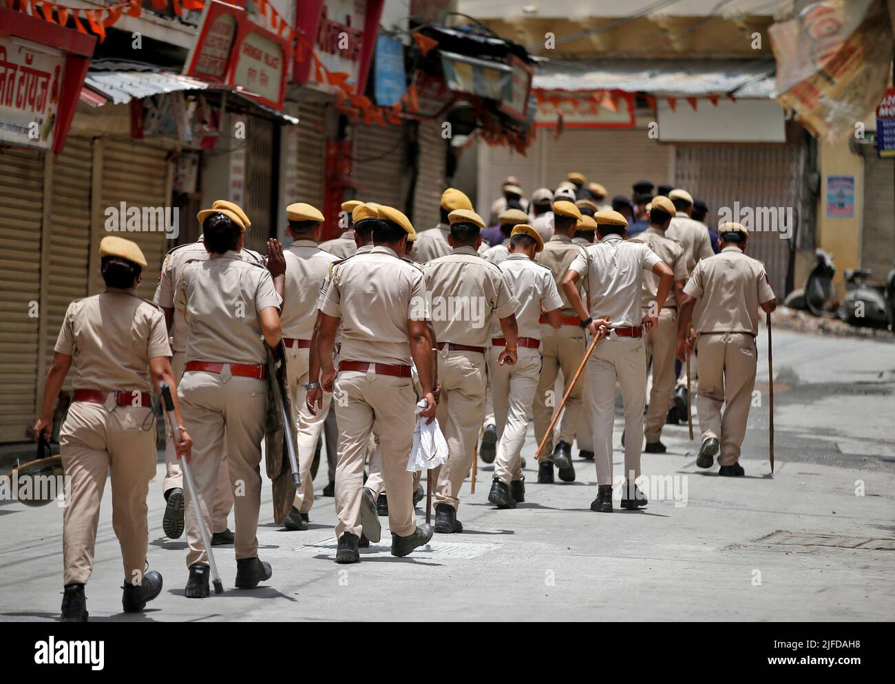 Members of the police patrol a street during restrictions imposed by authorities after the killing of Kanhaiya Lal Teli, a Hindu tailor, carried out by two suspected Muslim men who filmed the act and posted it online, in Udaipur in the northwestern state of Rajasthan, India, July 1, 2022. REUTERS/Amit Dave Stock Photo