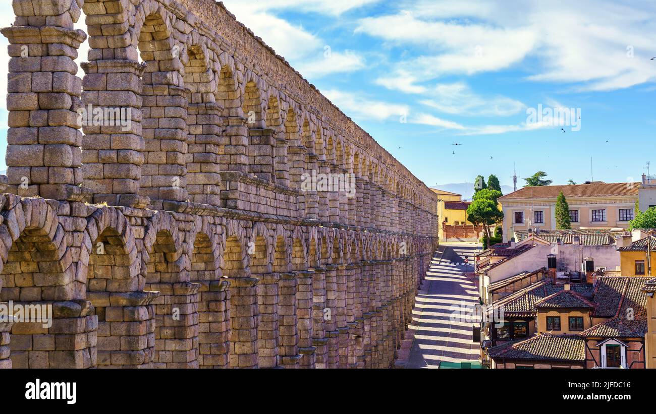 Aerial view of the impressive Roman aqueduct of Segovia at dawn, Spain ...