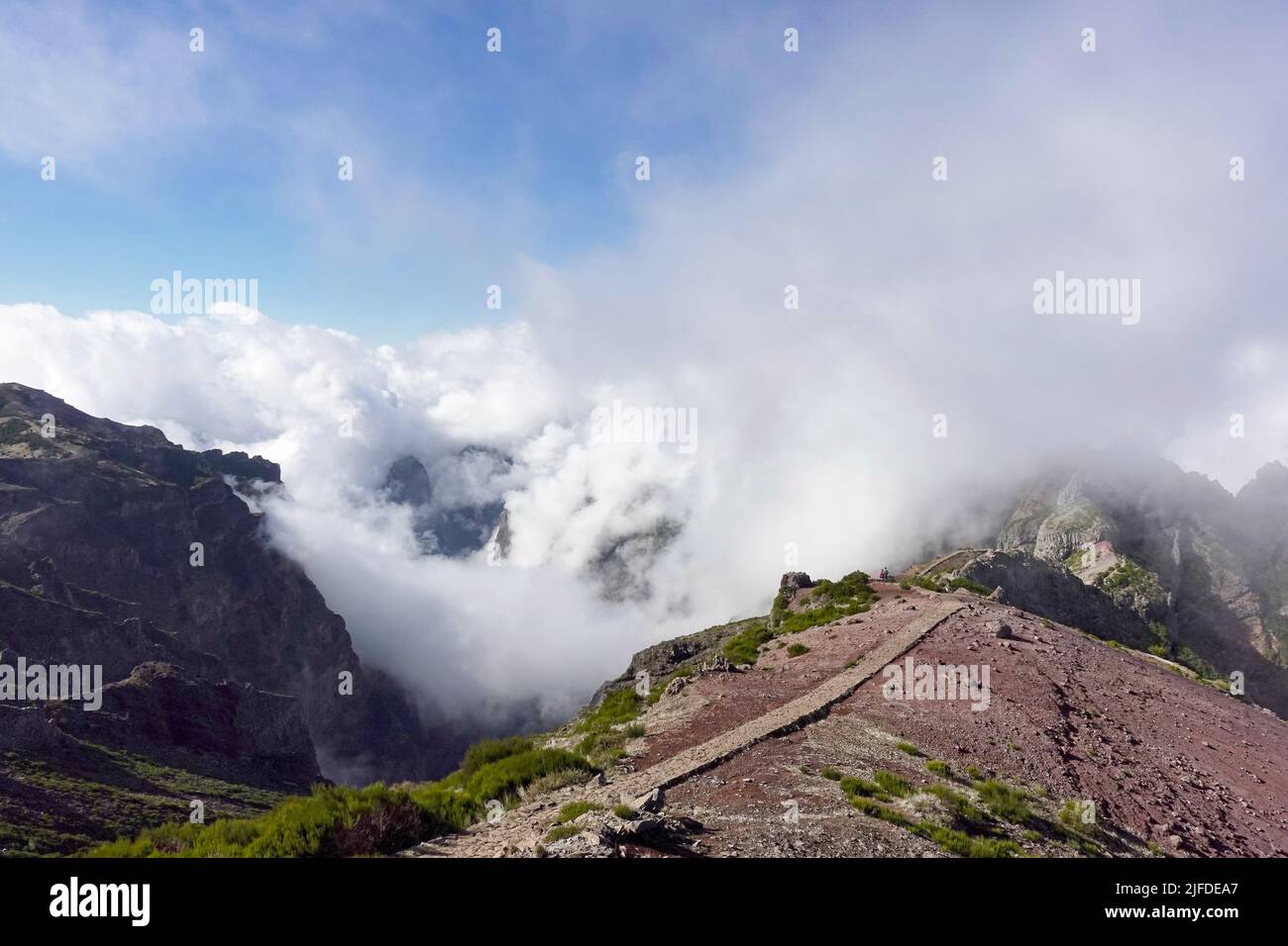 A landscape with mountain range covered in clouds Stock Photo - Alamy