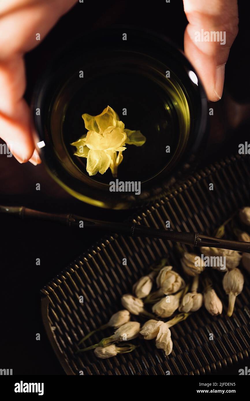 Tea tasting, steeped pure jasmine and dried tea, a traditional Chinese beverage - stock photo Stock Photo