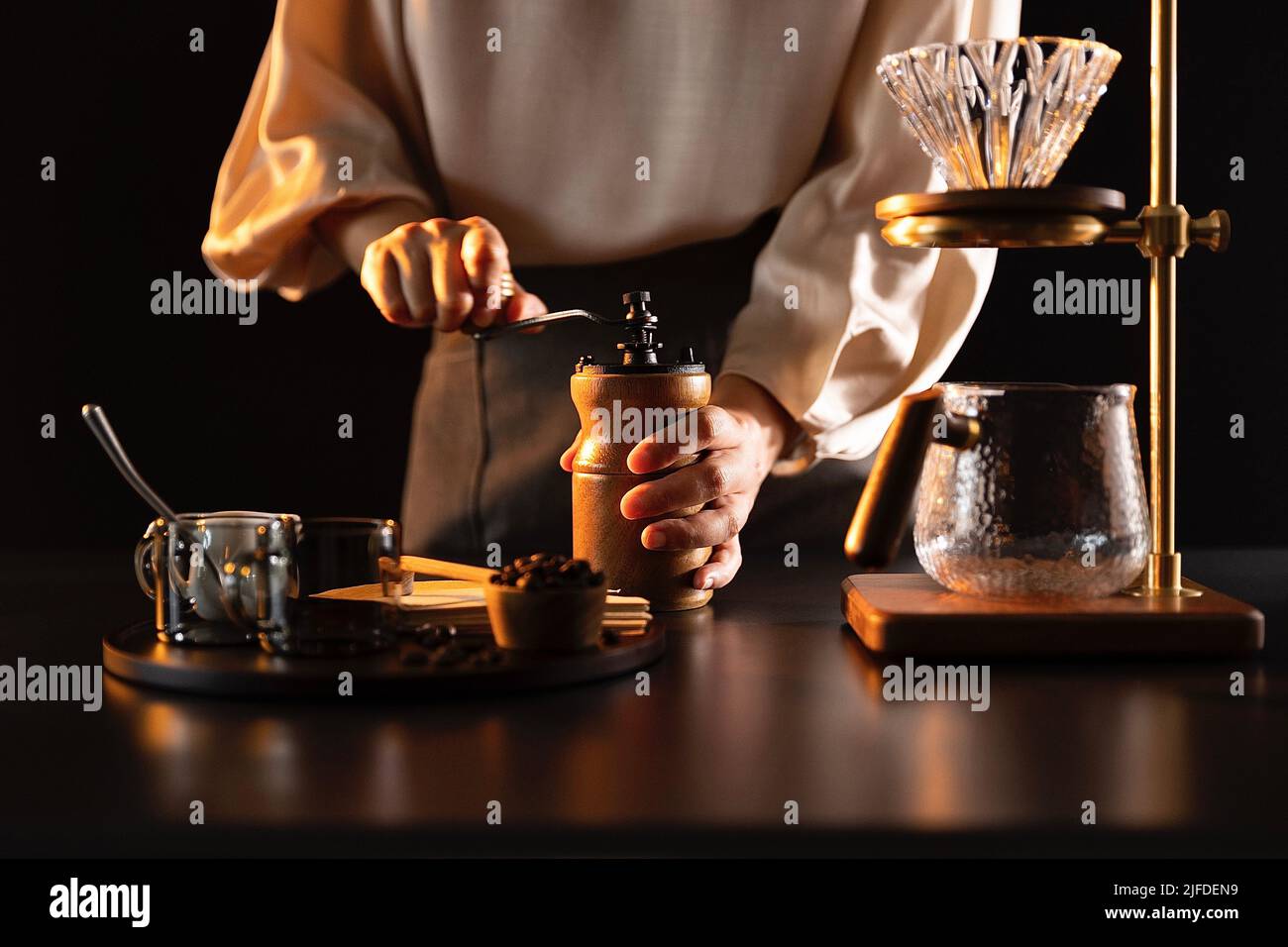 Grinding coffee beans, barista making handcrafted artisan coffee - stock photo Stock Photo
