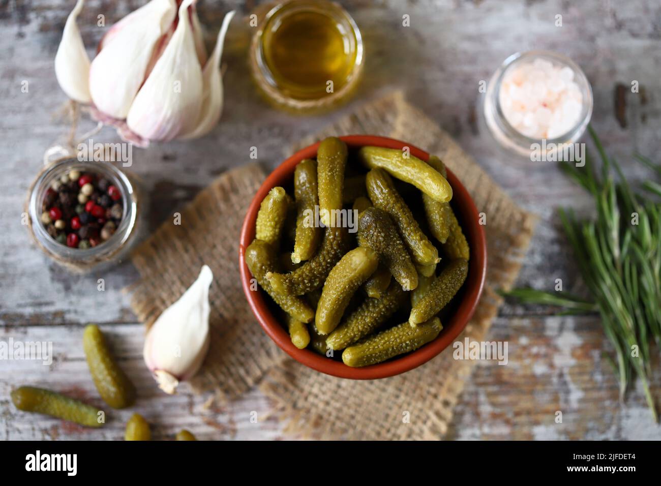 Gherkins. Mini gherkins in a bowl. Pickles. Condiments and spices. Stock Photo