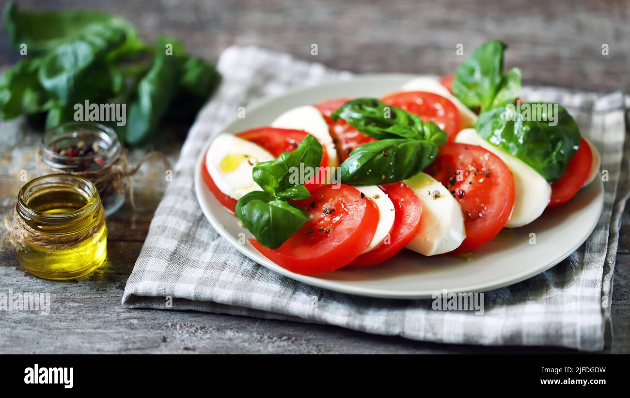 Traditional Italian caprese salad on a plate. Healthly food. Stock Photo