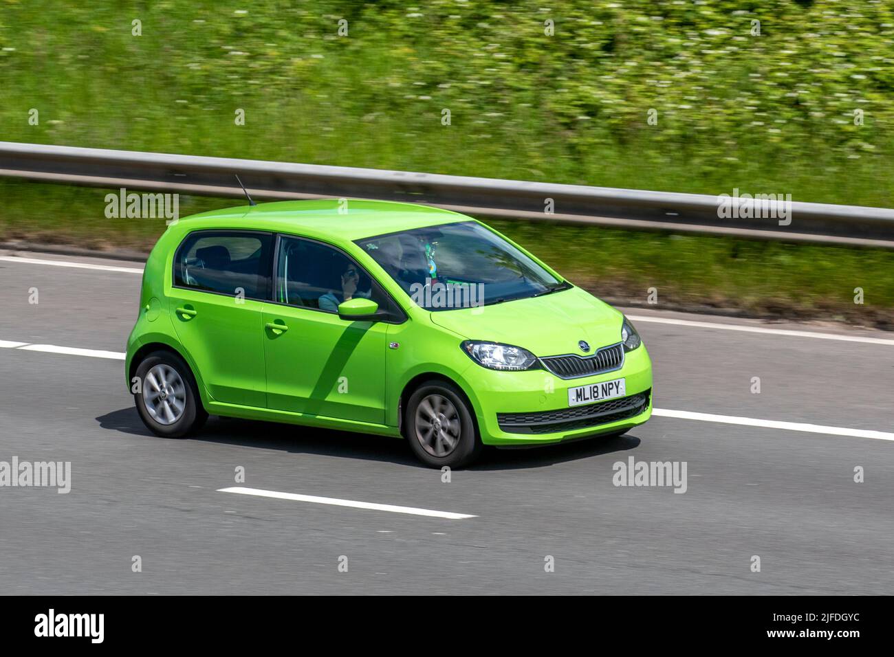 2019 green Skoda Citigo Se Mpi 60 999cc petrol hatchback; driving on the M6 Motorway, Manchester, UK Stock Photo
