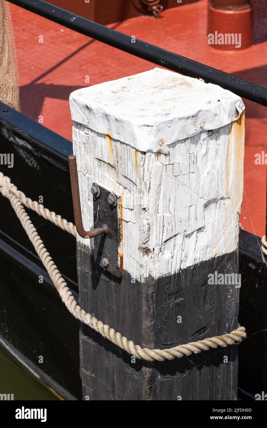 Enkhuizen, Netherlands. June 2022. Close up of a wooden mooring post. High quality photo Stock Photo