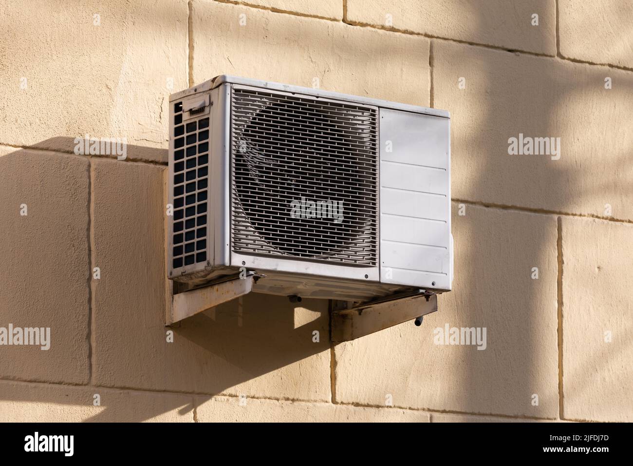 outdoor unit of a domestic air conditioner with a fan outside the building Stock Photo Alamy