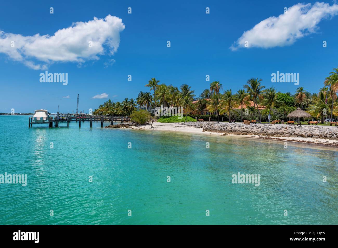 Sunset Beach and pier in beach state park and palm trees in Florida Keys Stock Photo
