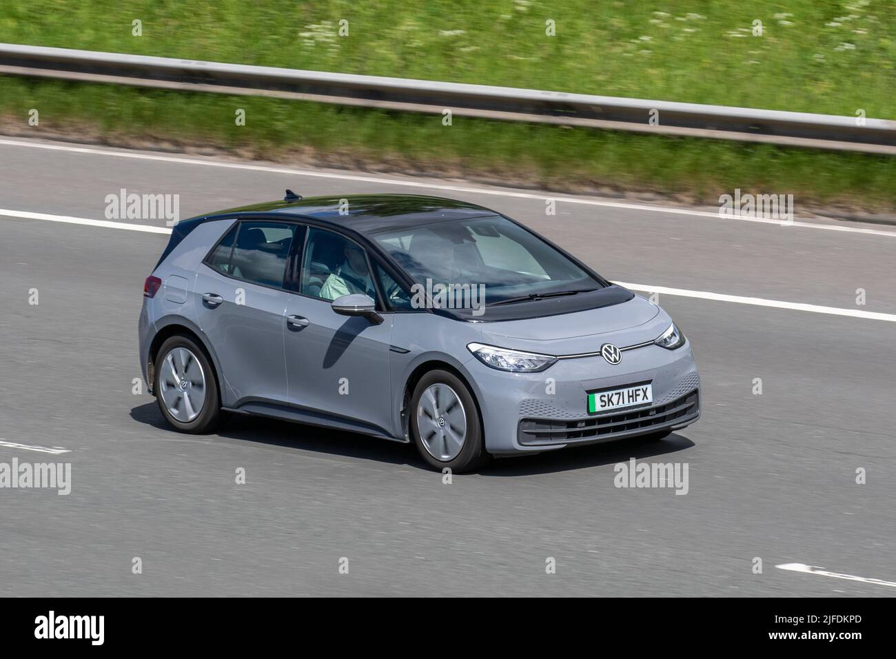 2021 VW Volkswagen Id3 Life 145 Pro 58KWH Battery Auto grey Electricity hatchback; driving on the M6 Motorway, Manchester, UK Stock Photo