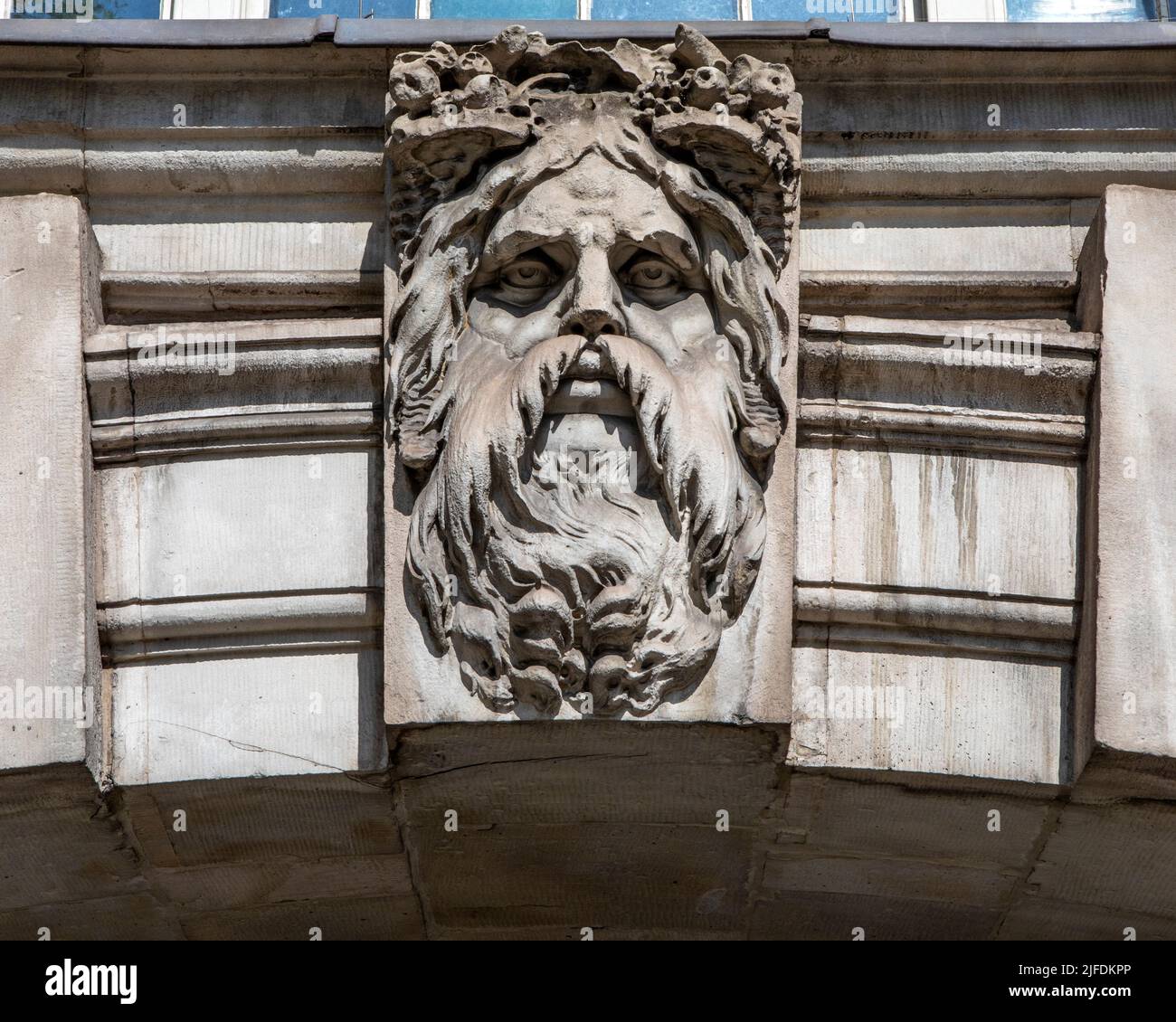 A sculpture of Old Father Thames, on the exterior of Somerset House in London, UK.  Old Father Thames is Londons very own river God named after the Ri Stock Photo