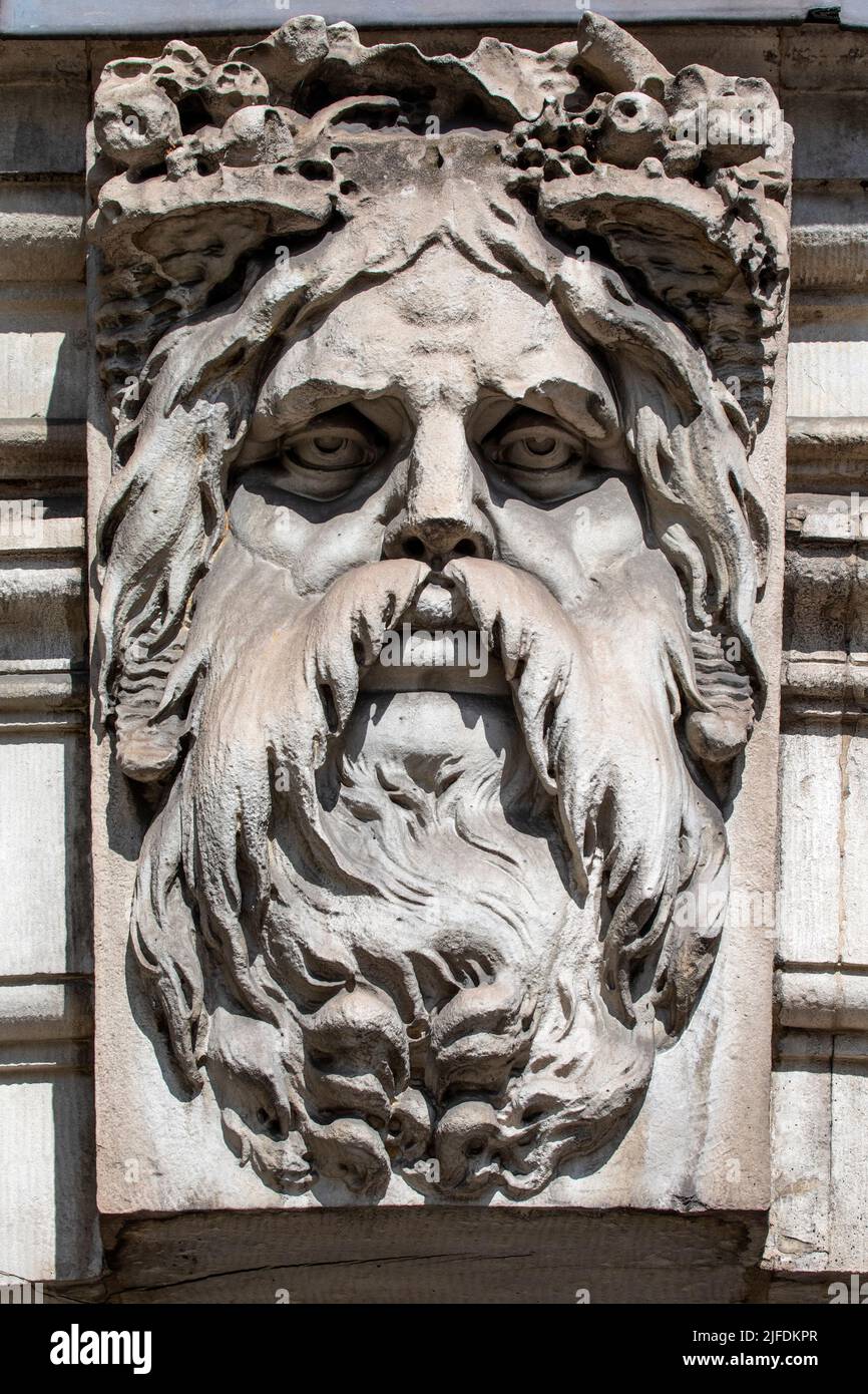A sculpture of Old Father Thames, on the exterior of Somerset House in London, UK.  Old Father Thames is Londons very own river God named after the Ri Stock Photo