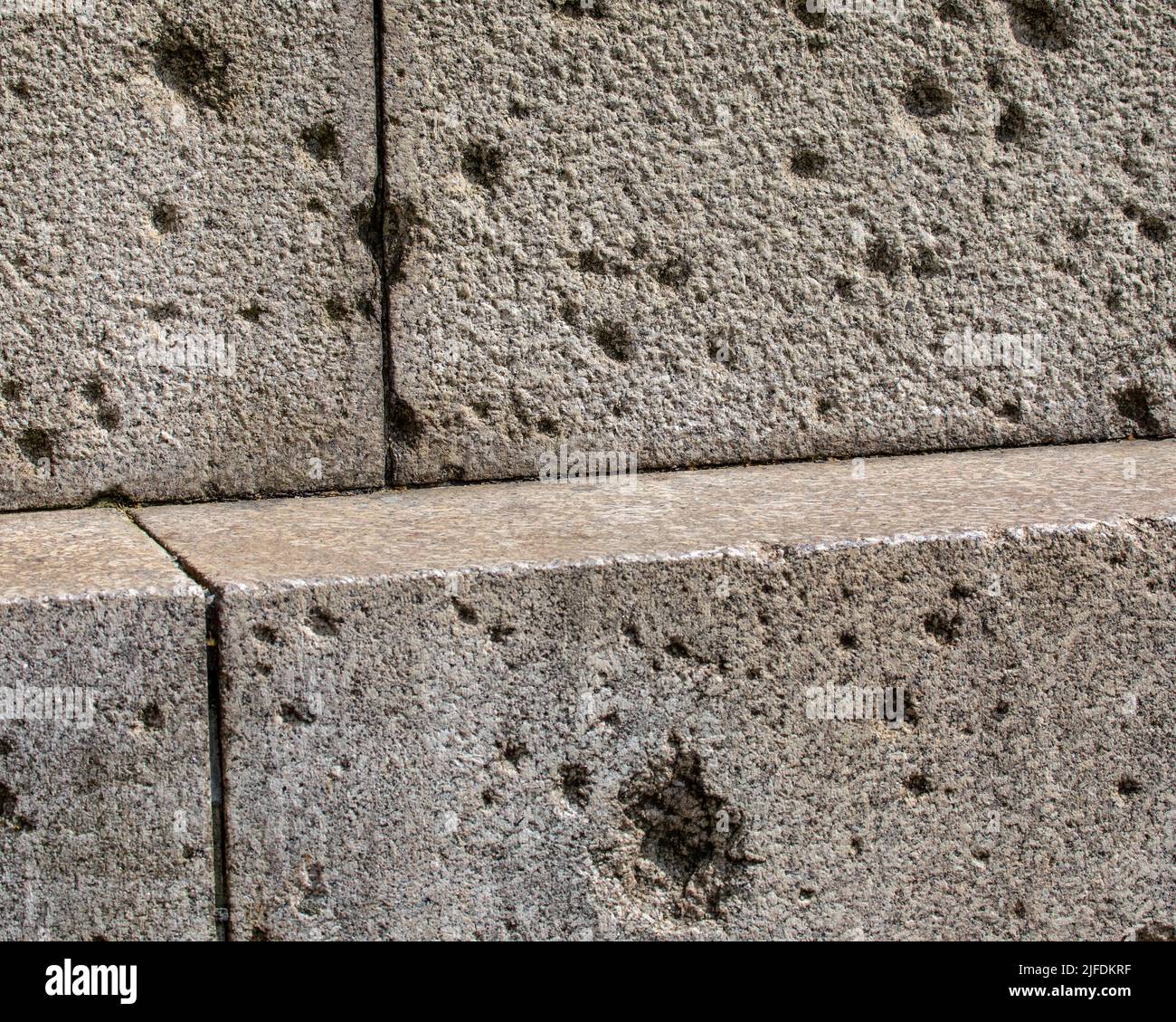 Damage Types Shrapnel Close-up of shrapnel damage on the base of Cleopatras Needle in London ...